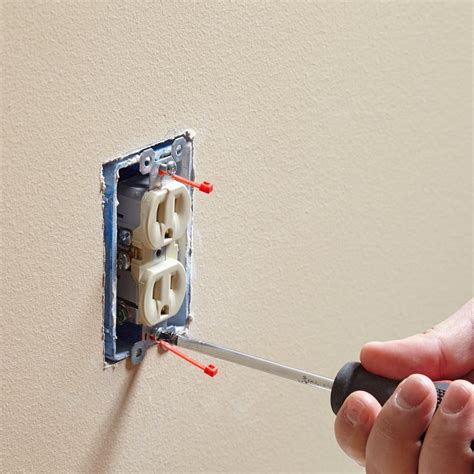 ceiling electrical box screw hole stripped|how to remove outlet box.